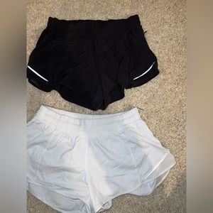 LULULEMON hotty hot low rise lined shorts - 2 pairs (1 black, 1 white) size 8